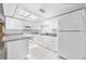 Bright kitchen with white cabinets, granite countertops and stainless appliances at 2947 Larson St, Kissimmee, FL 34741