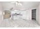 Open kitchen area featuring white cabinets and white tile flooring at 2947 Larson St, Kissimmee, FL 34741