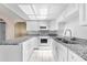 Bright kitchen featuring white cabinets, stainless steel appliances and granite counters at 2947 Larson St, Kissimmee, FL 34741