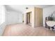 Bright laundry area with tile floors and a large utility sink near a closet and doorway at 2947 Larson St, Kissimmee, FL 34741