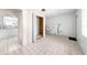 Tiled laundry room with washer hookups, utility sink, storage space, and natural light at 2947 Larson St, Kissimmee, FL 34741