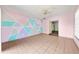 Living room featuring a modern accent wall and ceramic tile at 2947 Larson St, Kissimmee, FL 34741