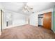 Spacious main bedroom with ensuite bathroom, ceiling fan, and walk-in closet at 2947 Larson St, Kissimmee, FL 34741