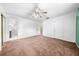 Spacious main bedroom with ensuite bathroom, ceiling fan, and ample closet space at 2947 Larson St, Kissimmee, FL 34741
