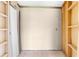 Unfinished storage room in needs of repairs, with tile floors and shelves for storing items at 2947 Larson St, Kissimmee, FL 34741