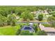 Neighborhood aerial featuring tree-lined streets, solar panels, and well-maintained landscaping at 30 Lake Diamond Ave, Ocala, FL 34472