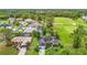 Overhead view displays golf course community surrounded by lush greenery at 30 Lake Diamond Ave, Ocala, FL 34472
