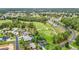 Expansive aerial view of a golf course community with well-manicured lawns and lush green surroundings at 30 Lake Diamond Ave, Ocala, FL 34472