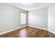 Bedroom features hardwood floors and a large window at 30 Lake Diamond Ave, Ocala, FL 34472