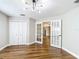 Bright bedroom featuring hardwood floors, french doors, and a closet at 30 Lake Diamond Ave, Ocala, FL 34472