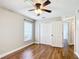 Bright bedroom featuring wood floors, closet, neutral walls, and window at 30 Lake Diamond Ave, Ocala, FL 34472