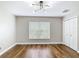 Bright bedroom featuring hardwood flooring and a modern ceiling light creates a serene and inviting space at 30 Lake Diamond Ave, Ocala, FL 34472