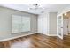 Bright bedroom featuring hardwood floors, a window, and a closet at 30 Lake Diamond Ave, Ocala, FL 34472