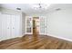 Bright bedroom featuring hardwood floors, french doors, and a closet at 30 Lake Diamond Ave, Ocala, FL 34472