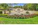 A beautiful Lake Diamond Golf & Country Club entrance with manicured landscaping and fountain at 30 Lake Diamond Ave, Ocala, FL 34472