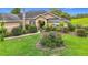 Charming one-story home with a well-manicured lawn and lush landscaping, perfect for curb appeal at 30 Lake Diamond Ave, Ocala, FL 34472