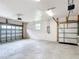 Spacious garage with two car garage doors, high ceilings, and bright interior at 30 Lake Diamond Ave, Ocala, FL 34472
