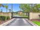 Lake Diamond community gate with brick pillars and wrought iron, ensuring privacy for its residents at 30 Lake Diamond Ave, Ocala, FL 34472