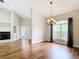 Open living room featuring hardwood floors, a fireplace, and natural light, creating an inviting space at 30 Lake Diamond Ave, Ocala, FL 34472