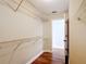 Well-organized walk-in closet with shelves and view of entry door at 30 Lake Diamond Ave, Ocala, FL 34472