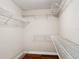 Spacious walk-in closet featuring ample shelving for storage and organization at 30 Lake Diamond Ave, Ocala, FL 34472
