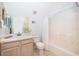Clean bathroom with vanity, toilet, tub and shower combination with updated fixtures at 3647 Minute Maid Ramp Rd 1 Rd, Davenport, FL 33837