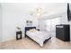 Relaxing bedroom with a comfortable bed, modern furnishings, tile flooring, and a bright window at 3647 Minute Maid Ramp Rd 1 Rd, Davenport, FL 33837