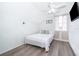 Bright bedroom with a ceiling fan, a window and light colored walls and flooring at 3647 Minute Maid Ramp Rd 1 Rd, Davenport, FL 33837