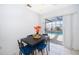 Bright dining area next to sliding glass doors leading to a screened pool at 3647 Minute Maid Ramp Rd 1 Rd, Davenport, FL 33837