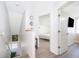 Bright hallway features stylish decor, natural light, and modern flooring leading to bedrooms at 3647 Minute Maid Ramp Rd 1 Rd, Davenport, FL 33837