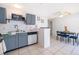The kitchen features stainless steel appliances and an eat-in dining area at 3647 Minute Maid Ramp Rd 1 Rd, Davenport, FL 33837