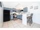 Well lit kitchen features stainless steel appliances and light blue cabinets at 3647 Minute Maid Ramp Rd 1 Rd, Davenport, FL 33837
