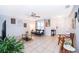 Bright living room features tile floors, contemporary furniture, and a large window with natural light at 3647 Minute Maid Ramp Rd 1 Rd, Davenport, FL 33837
