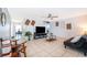 Cozy living room features neutral tile flooring, modern furnishings, and plenty of natural light at 3647 Minute Maid Ramp Rd 1 Rd, Davenport, FL 33837