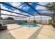 Large screened-in pool with ample patio space, perfect for entertaining at 3647 Minute Maid Ramp Rd 1 Rd, Davenport, FL 33837