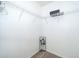Empty walk-in closet with wire shelves and wood-style flooring, ready for storage and organization at 3647 Minute Maid Ramp Rd 1 Rd, Davenport, FL 33837