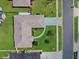 An aerial view shows a manicured green lawn and a long, paved driveway at 3811 Gator Bay Ln, St Cloud, FL 34772