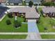 This is an aerial view of a well-maintained house in a suburban neighborhood at 3811 Gator Bay Ln, St Cloud, FL 34772