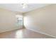 This bedroom features tile floors, neutral walls, and natural light at 3811 Gator Bay Ln, St Cloud, FL 34772