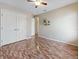 Bedroom with decorative floors, neutral walls, closet, ceiling fan, and decor at 3811 Gator Bay Ln, St Cloud, FL 34772