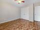 Bedroom with ceiling fan, floors, neutral walls and large closet at 3811 Gator Bay Ln, St Cloud, FL 34772
