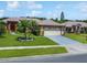 Charming home with mature landscaping, well-manicured lawn, and a two-car garage at 3811 Gator Bay Ln, St Cloud, FL 34772