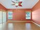 Bright living room with large windows and ceramic tile flooring, offering plenty of natural light at 3811 Gator Bay Ln, St Cloud, FL 34772