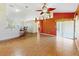 Open living room features ceramic tile flooring, ceiling fan and access to dining area at 3811 Gator Bay Ln, St Cloud, FL 34772
