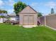 The property boasts a backyard shed on lush green lawn with mature trees at 3811 Gator Bay Ln, St Cloud, FL 34772