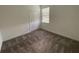 Bright bedroom features neutral carpet, closet, and a window with blinds at 4053 Redbridge Loop, Davenport, FL 33837