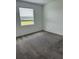 Bedroom featuring carpeted flooring and a window for lots of natural light at 4053 Redbridge Loop, Davenport, FL 33837
