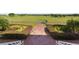 Beautiful golf course view with a paved path and manicured landscaping at 4053 Redbridge Loop, Davenport, FL 33837