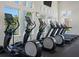 Well-equipped gym featuring cardio equipment and ample natural light at 4053 Redbridge Loop, Davenport, FL 33837