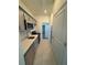 Galley kitchen boasts modern appliances and open access to the bedrooms at 4053 Redbridge Loop, Davenport, FL 33837